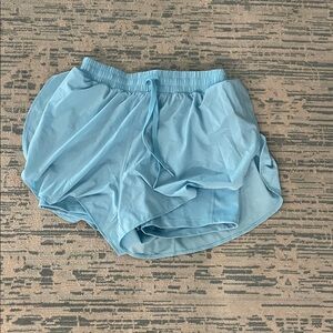 Baby blue shorts with drawstrings and built in shorts. Woman’s extra small.